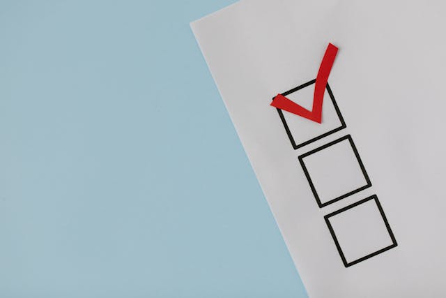 Red check mark in a box